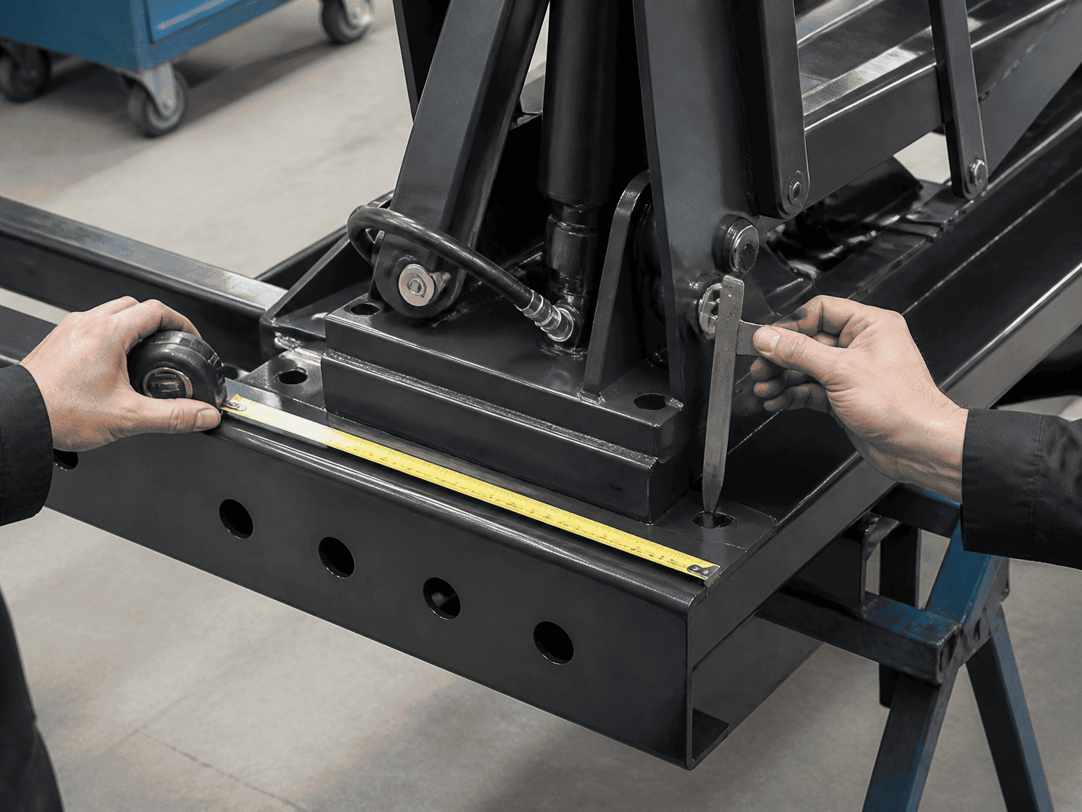 measuring hydraulic power hoist base dimensions and mounting clearance